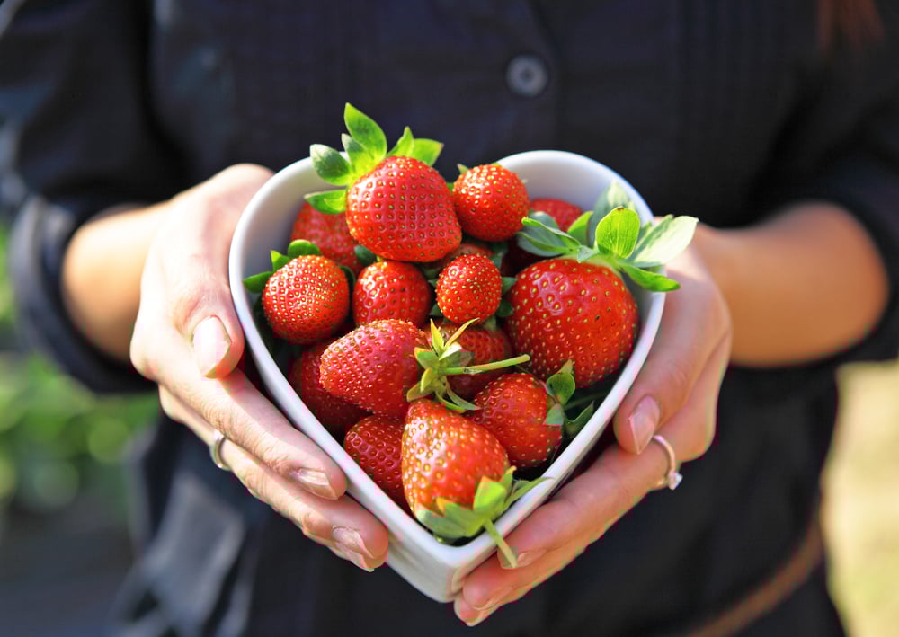 strawberry in heart shape bowl